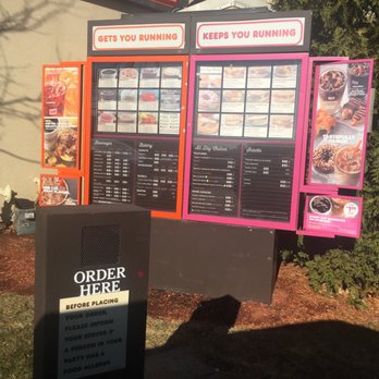Dunkin' - a menu and order board in front of a building - Donuts Near Me - Merrimack, New Hampshire Dunkin' - a menu and order board in front of a building - Donuts Near Me - Merrimack, New Hampshire