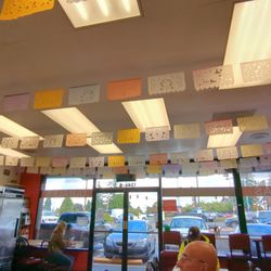 Don Chuy's - Colorful ceiling banner, window bar seating