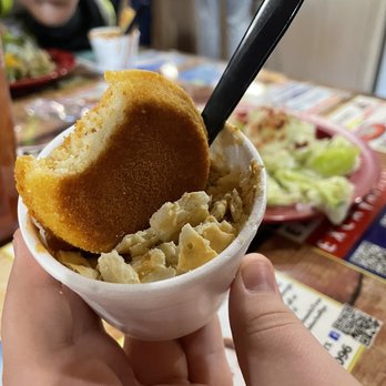 Ole West Bean & Burger - a person holding a bowl of food - Burgers Near Me - Mabank, Texas
