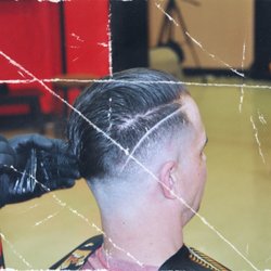 Mr J's Barber Shop - Clean skin fade with side part.
