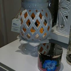 Bath & Body Works - Big selection of candle holders (large & small) at this location.
