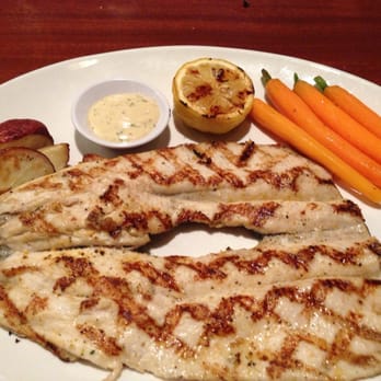 Seasons 52 - Grilled boneless trout, red potatoes and baby carrots. - New American Near Me - Plano, Texas