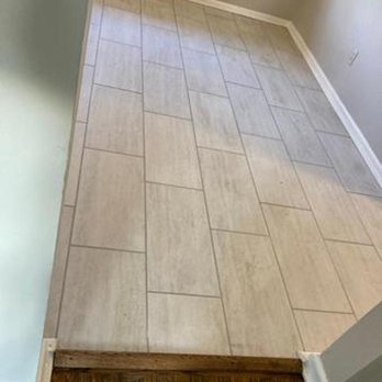 Joe's Remodeling Solutions - a tile floor in a hallway - General Contractors Near Me