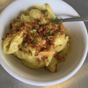 Gina’s Vegan A Go Go - Our vegan Mac & Cheez - homemade and so good! Topped with homemade coconut bacon or kick it up a notch with jalapenos! - Vegan Near Me - Columbia, Missouri Gina’s Vegan A Go Go - Our vegan Mac & Cheez - homemade and so good! Topped with homemade coconut bacon or kick it up a notch with jalapenos! - Vegan Near Me - Columbia, Missouri