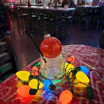 The Rooftop - a table with lights and decorations - Burgers Near Me - Buford, Georgia