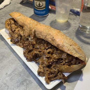 Danny's Steak - Whiz Wit Cheesesteak~ Shaved ribeye, caramelized onions, house-made Cheese Whiz sandwiched between in-house baked sesame roll - Cheesesteaks Near Me - Syracuse, New York