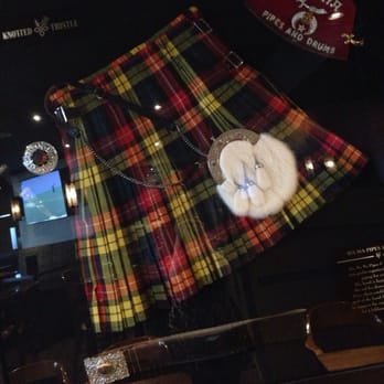 Knotted Thistle Pub - a kilt and a bottle of beer - Pubs Near Me - Regina, Saskatchewan
