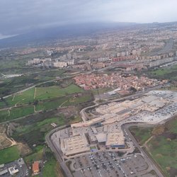 Porte di Catania - Climbing out of and near CTA is Porte di Catania shopping, with ample parking and Mt. Etna with its peak in the clouds beyond (no review)