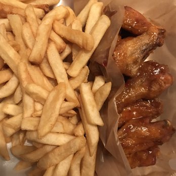 Wing Dash - Bone-in wings with mango habanero sauce and a generous portion of fries. Tasty! - American Near Me - Farmers Branch, Texas
