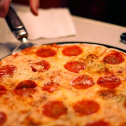 Epiphany Bowling Lanes - Our delicious St. Louis style pizza from (local business) The Christy!