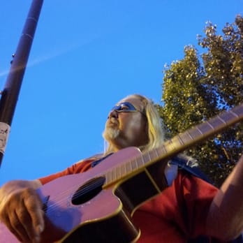Guitar Man - His performance last night was magical. Notice the electric blue sky behind him. - Musicians Near Me Guitar Man - His performance last night was magical. Notice the electric blue sky behind him. - Musicians Near Me