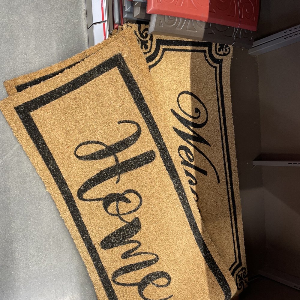 a door mat with the word home on it a door mat with the word home on it