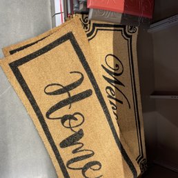 a door mat with the word home on it a door mat with the word home on it