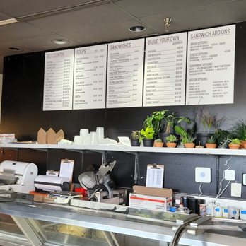 Fox's Deli - a man working behind the counter - Soup Near Me - Rochester, New York