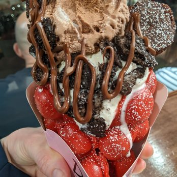 Double Three - Red velvet waffle with vanilla and chocolate scoops, topped with Oreo cookies, a brownie, and Nutella drizzle. - Ice Cream & Frozen Yogurt Near Me - Kailua, Hawaii Double Three - Red velvet waffle with vanilla and chocolate scoops, topped with Oreo cookies, a brownie, and Nutella drizzle. - Ice Cream & Frozen Yogurt Near Me - Kailua, Hawaii