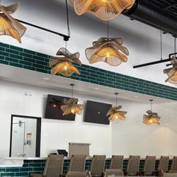 Raices - A sneak peek of our bar area and our hand-made light fixtures imported from Mexico!