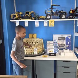 Bricks & Minifigs Charleston - Dakari checking out sets