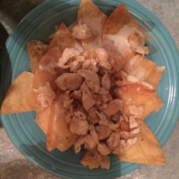 Ordered a whole order of chicken nachos and were given a half order. Looks gross right? It was.