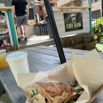 Cafe Alani - Salmon croissant and coffee and juice on a perfect outdoor seating area - Creperies Near Me - Honolulu, Hawaii Cafe Alani - Salmon croissant and coffee and juice on a perfect outdoor seating area - Creperies Near Me - Honolulu, Hawaii