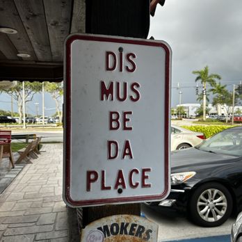 Spanky's Speakeasy - a sign that reads dis must be da place - New American Near Me - Naples, Florida
