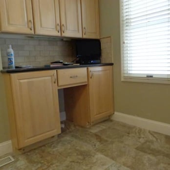 Patrick Interior Finish, LLC. - a kitchen with light wood cabinets and black counter tops - General Contractors Near Me - Ballwin, Missouri Patrick Interior Finish, LLC. - a kitchen with light wood cabinets and black counter tops - General Contractors Near Me - Ballwin, Missouri