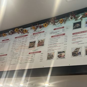Terra Mia Pizzeria Tustin - menu on the wall. very hard to see. - Pizza Near Me - Tustin, California