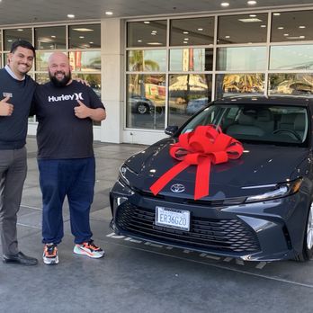 Envision Norwalk Toyota | Sales Showroom - Arron and me with my brand new car! - Auto Repair Near Me - Norwalk, California Envision Norwalk Toyota | Sales Showroom - Arron and me with my brand new car! - Auto Repair Near Me - Norwalk, California