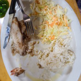 Grilled fish with rice and coleslaw. Grilled fish with rice and coleslaw.