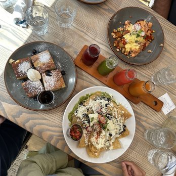 The Garden Table - Blueberry Hotcake Stack Plates Smoked Salmon Hash Plates Chilaquiles Plates Juice flight - Breakfast & Brunch Near Me - Indianapolis, Indiana The Garden Table - Blueberry Hotcake Stack Plates Smoked Salmon Hash Plates Chilaquiles Plates Juice flight - Breakfast & Brunch Near Me - Indianapolis, Indiana