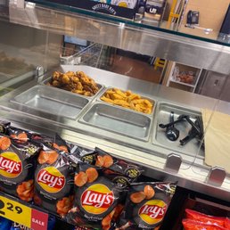 a display of chips and other snacks a display of chips and other snacks