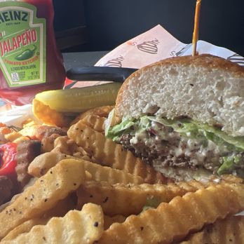 Tornado's Grub and Pub - Closeup of the burger with jalapeño ketchup! - American Near Me - Cedar Rapids, Iowa
