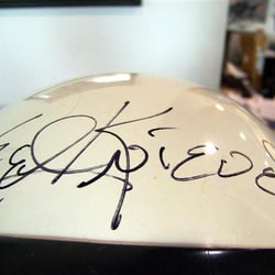 A customer owns this helmet autographed by Evel Knievel. It's on display at the shop.