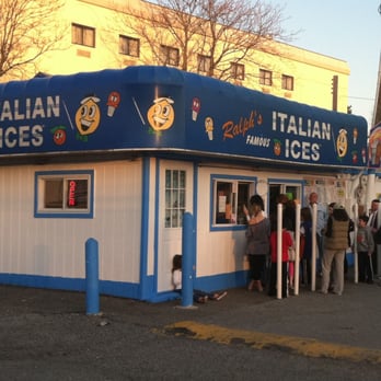 Ralph's Famous Italian Ices - a line of people standing outside of a building - Ice Cream & Frozen Yogurt Near Me - Syosset, New York