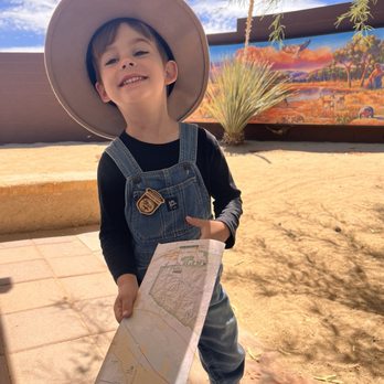 Joshua Tree Visitor Center - Holding his map of the Joshua tree Park right after getting a junior Ranger badge at the visitor center. - Visitor Centers Near Me - Joshua Tree, California