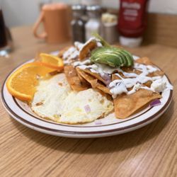 Noe’s Cafe - Chilaquiles with green salsa, two eggs over medium.