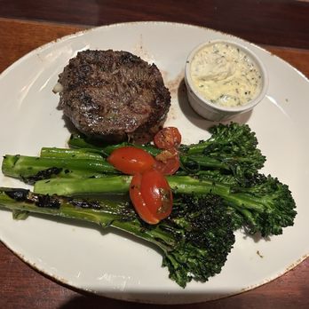 The Ranch - 8oz 8 Oz. Roasted Garlic Stuffed Pnb Filet with Grilled Broccolini & Tomatoes - Steakhouses Near Me - Irving, Texas