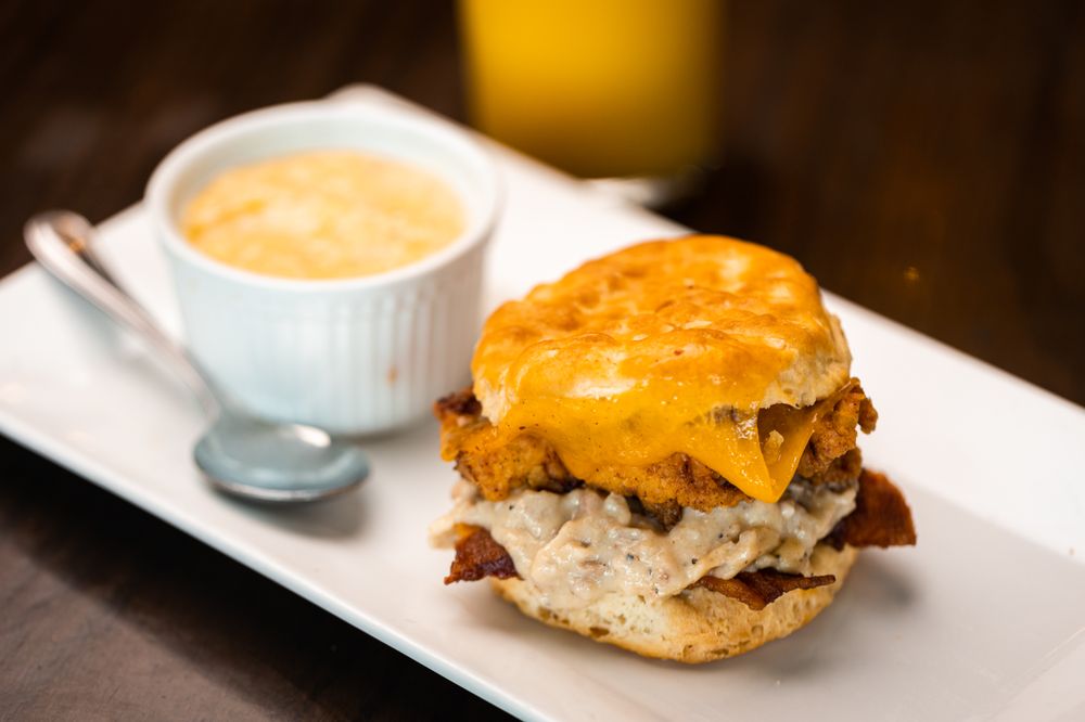 The Rooster Biscuit + pimento cheese grits are a fanfavorite breakfast