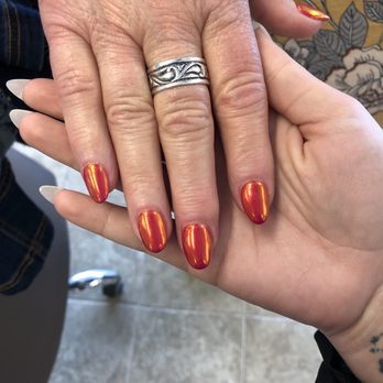 Gel Nails - view of the clients nails she absolutely loved them we used a hot pink and turned it with this chrome for a little more jazz Done by Chris - Nail Salons Near Me - Alliance, Ohio