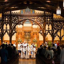 The processional makes its way through the magnificent nave as worshippers gather for Sunday Eucharist.