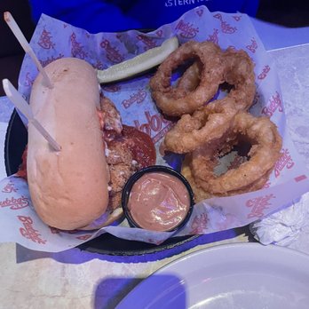 Bubba's 33 - Chicken Parmesan Sandwich with Onion Rings - Sports Bars Near Me - Pensacola, Florida Bubba's 33 - Chicken Parmesan Sandwich with Onion Rings - Sports Bars Near Me - Pensacola, Florida