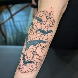 Pioneer Tattoo - Andi Ink did a wonderful job adding some beautiful clouds and stars to a pre-existing bat tattoo.