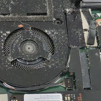 Computer Tech Solutions - Laptop cooling fan and heatsink before internal cleaning service. - IT Services & Computer Repair Near Me - Orlando, Florida Computer Tech Solutions - Laptop cooling fan and heatsink before internal cleaning service. - IT Services & Computer Repair Near Me - Orlando, Florida
