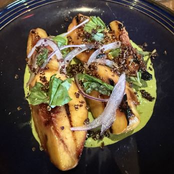 Compère Lapin - Grilled peaches on collard green goddess - Caribbean Near Me - New Orleans, Louisiana Compère Lapin - Grilled peaches on collard green goddess - Caribbean Near Me - New Orleans, Louisiana