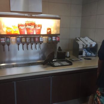 McDonald's - Crow eating from dispensers - Fast Food Near Me - Vancouver, British Columbia