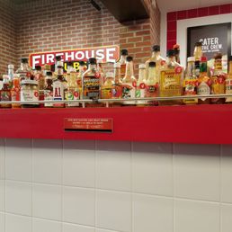 Huge hot sauce bar...bottles marked by 1-10 heat index