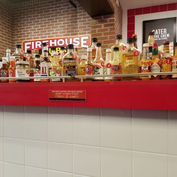 Firehouse Subs - Huge hot sauce bar...bottles marked by 1-10 heat index - Fast Food Near Me - Biddeford, Maine
