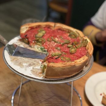 Giordano's - a pizza with a slice missing - Pizza Near Me - Westchester, Illinois