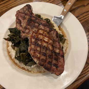 River Birch Lodge - Pork chop with grits and greens - New American Near Me - Winston-Salem, North Carolina River Birch Lodge - Pork chop with grits and greens - New American Near Me - Winston-Salem, North Carolina