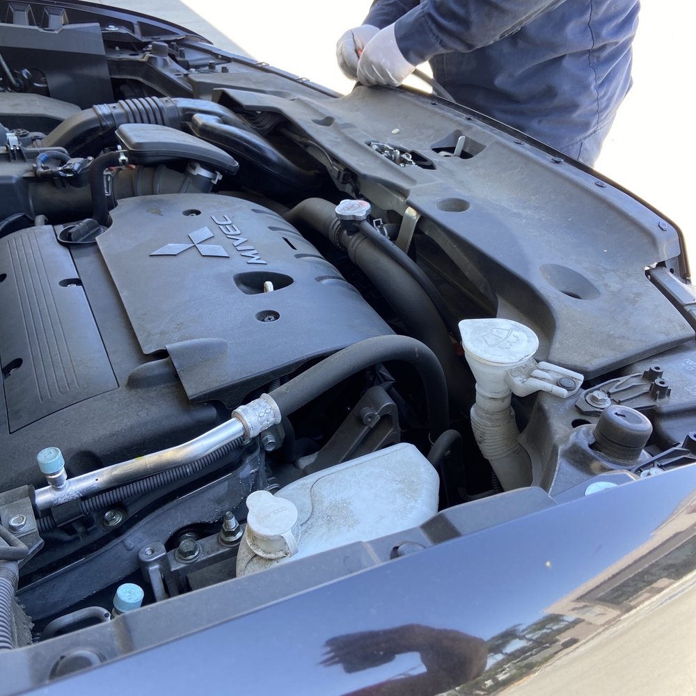 Brea Towing - Anas reinstalling the engine covering. - Towing Near Me - Brea, California Brea Towing - Anas reinstalling the engine covering. - Towing Near Me - Brea, California
