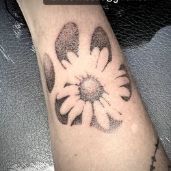 Viking Armor Tattoo - Daisy inside paw print tattoo by Tina Miller at Viking Armor Tattoo in Camp Hill, PA.